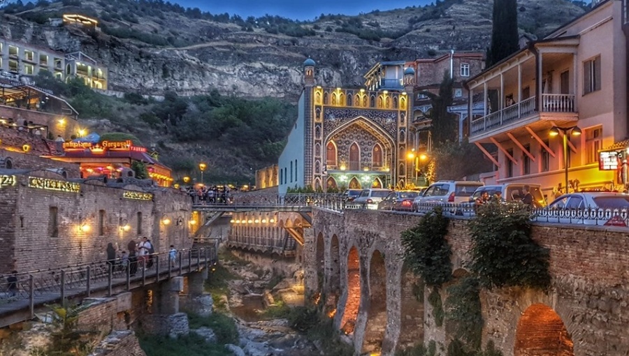 white metal bridge under blue sky during daytime